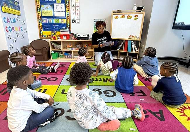 A teacher reads to students.